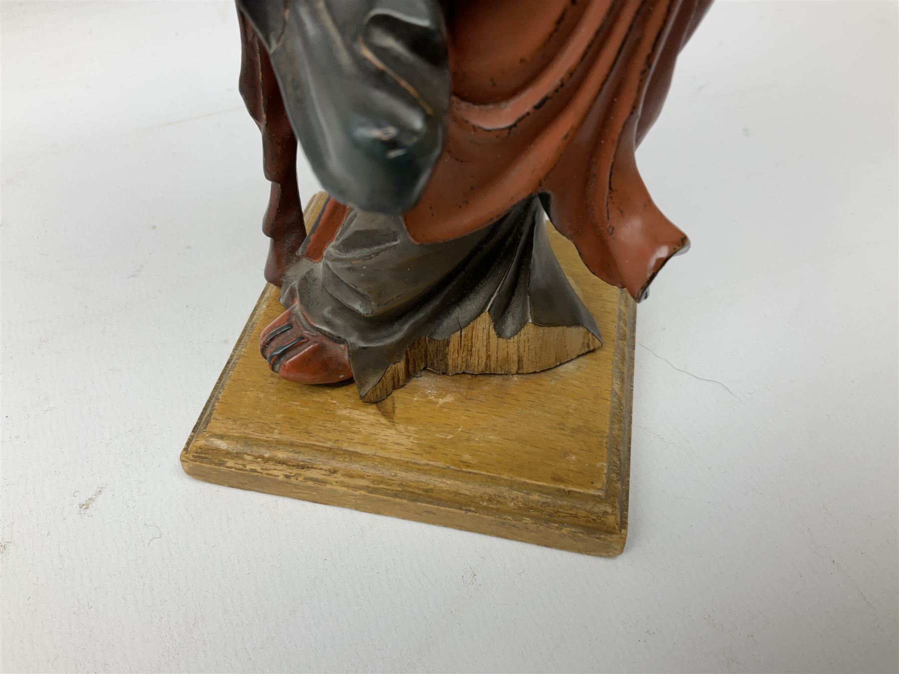 Three soapstone carvings, to include three toed dragon example, carved example with monkeys and another similar, together with carved wood figure, largest L29cm 