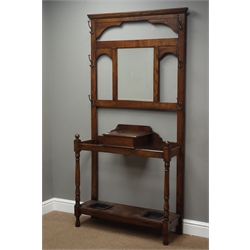  20th century oak hall stand, bevelled mirror back with hinged compartment, umbrella and stick stands either side, W94cm, H186cm, D30cm  