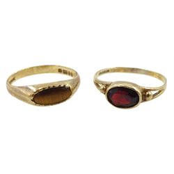 Gold oval garnet ring and a gold tiger's eye ring, both hallmarked 9ct