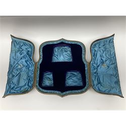 Victorian three-piece silver tea service, comprising teapot, twin handled open sucrier and milk jug, of oval form with shaped rim and C handles, each engraved with crests and bands of strapwork decoration, the milk jug and sucrier with gilt interiors, hallmarked Josiah Williams & Co, Exeter 1881, the teapot with ivory insulators and finial, all contained with a tooled leather, blue silk and velvet lined fitted case, retailed by West & Sun, Dublin 
This item has been registered for sale under Section 10 of the APHA Ivory Act