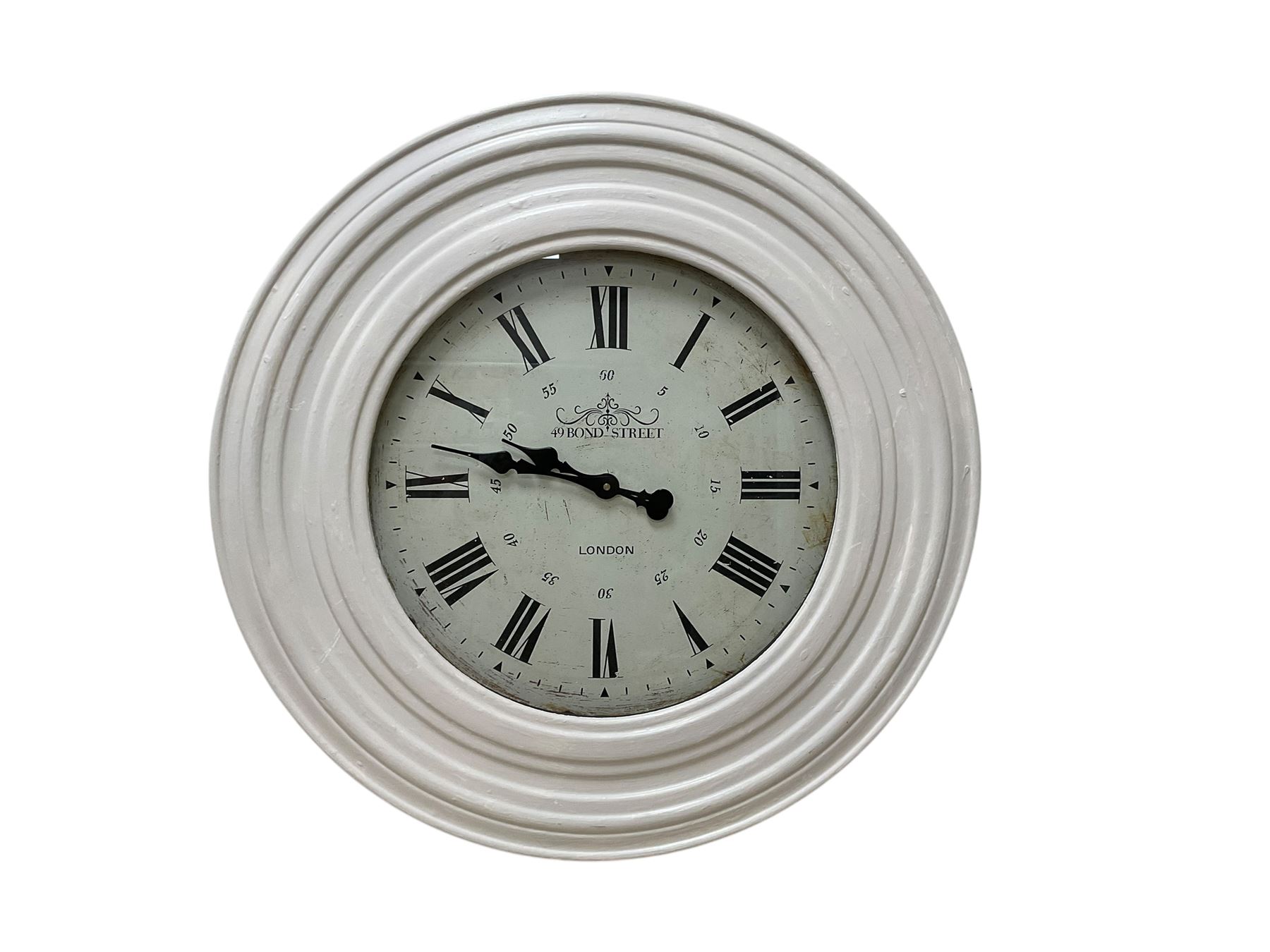 large quarts battery operated wall clock with an 18” dial and 30” painted wooden bezel, Roman numerals and baton hands.