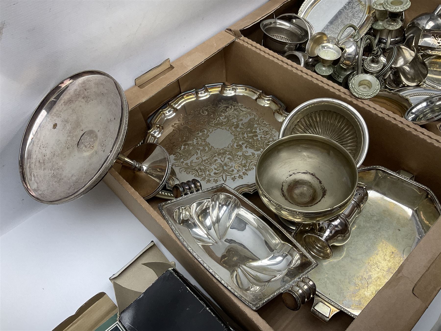 Quantity of silver plate and other metal ware, including sugar caster, tureens, serving dishes, pair of candelabra etc, in two boxes 