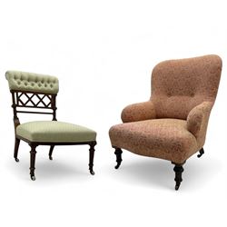Late Victorian upholstered armchair, with high camel back and deep seat, padded arms and b...