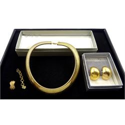 Christian Dior jewellery including expanding snake link collar necklace, pair of curved clip on earrings and a single clip on earring, with two Christian Dior boxes