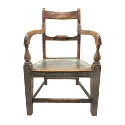 Late 18th century country elm armchair, the cresting rail with ebony stringing above a shaped centre rail, down swept arms on turnings terminating in square tapering supports, the supports joined by plain stretchers, plank seat, varying trances of paint finish