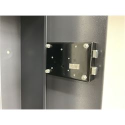Grey steel wall mounting gun cabinet to accommodate three guns; single door with two locks with two keys for one lock; internally H128.5cm W21cm D17.5cm; externally H129cm W21.5cm D20cm