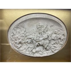 Justin Mathieu, two oval high relief plaque depicting a battle scenes, each within a wooden frame, frame  H21cm, L25cm