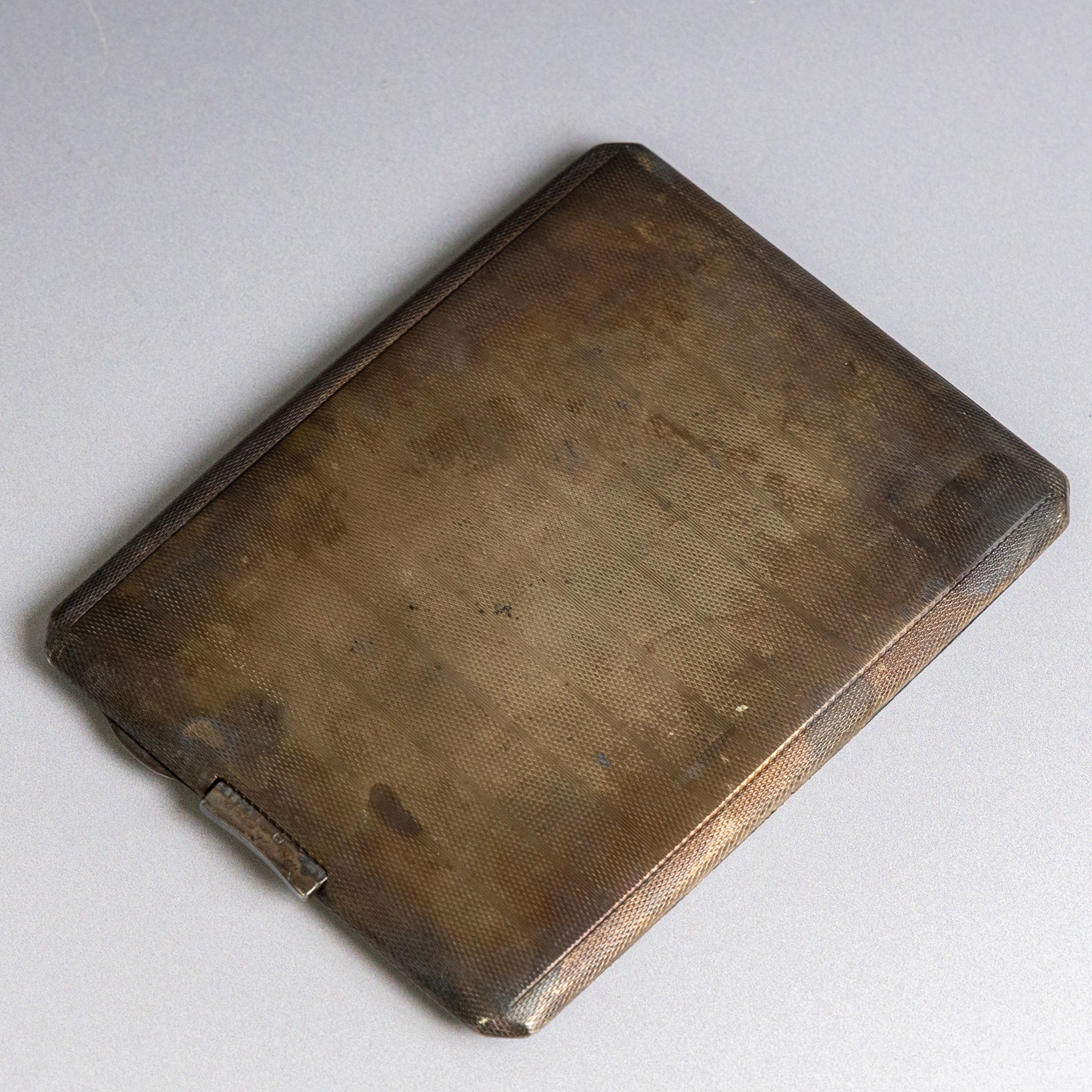 1930s silver cigarette case, with engine turned decoration and engraved initials to the top left hand corner, hallmarked Frederick Field, Birmingham 1931