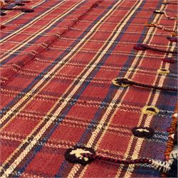 South West Persian Jajim kilim flatweave runner, composed of joined narrow woven bands,  field decorated with checked and striped motifs in shades of madder red, indigo, ivory ochre, and green, sides applied knotted wool tufts and braided elements with tasselled edges, (due to the large size, the runner is illustrated in two sections) 