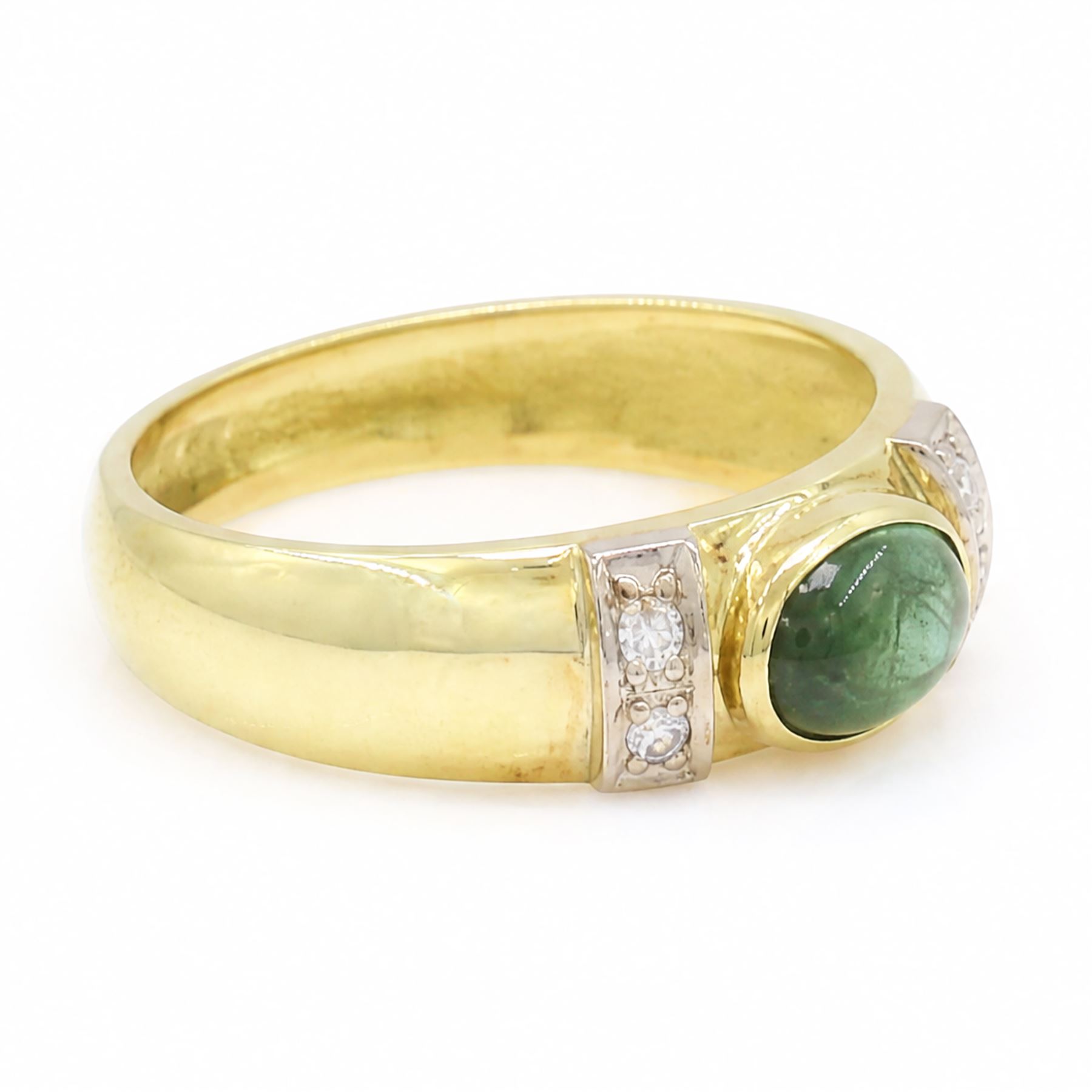 18ct gold tourmaline and diamond ring, bezel set single oval cut tourmaline, with two single cut diamonds set either side, stamped 