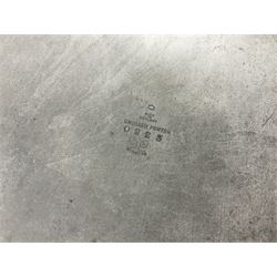 Pair of Solkets English pewter candlesticks, the bud shaped sockets raised upon three angular fin supports and a slightly domed circular base with cast stylised foliate decoration, H23cm