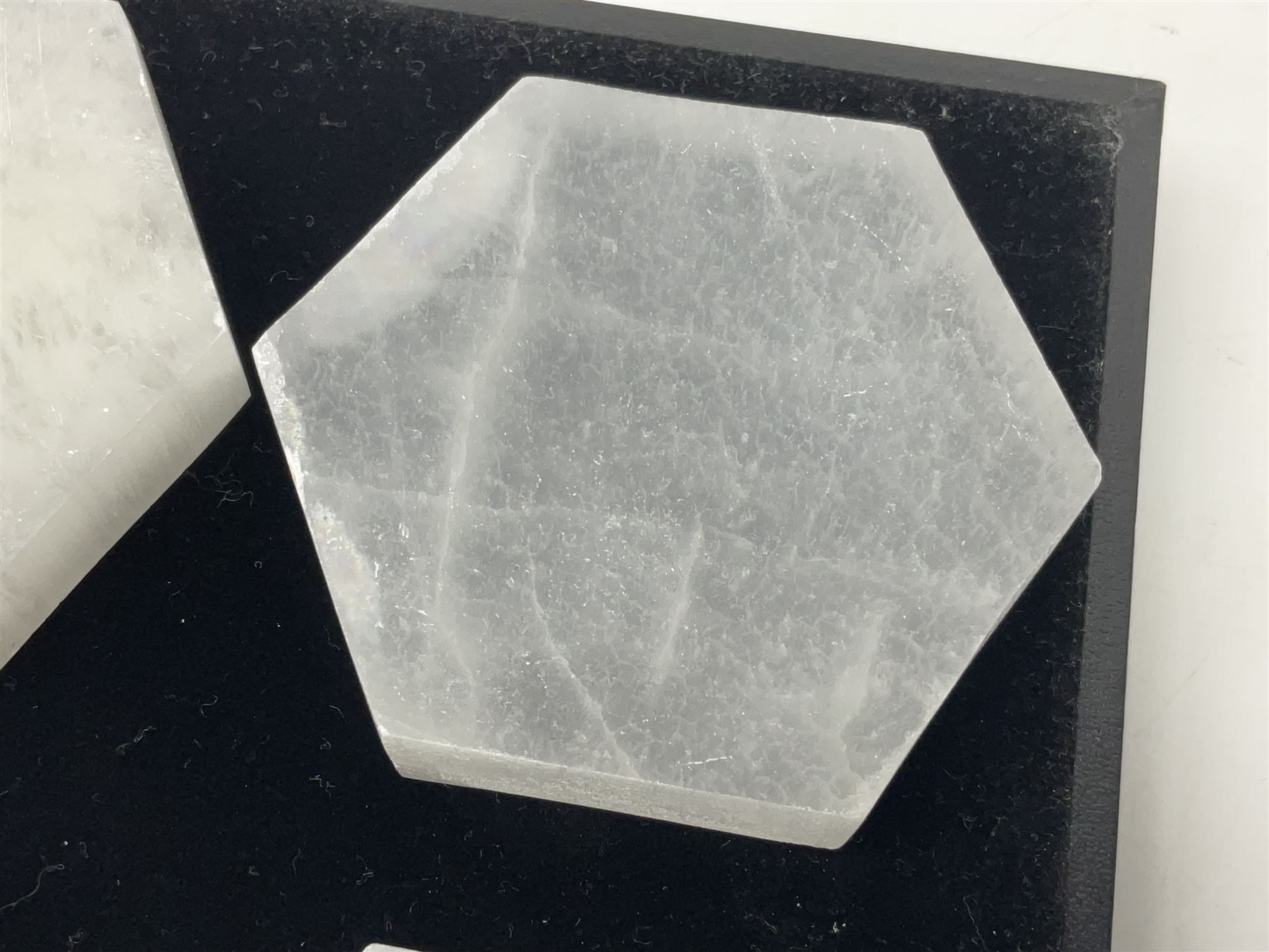 Set of six selenite hexagonal coasters, D7cm