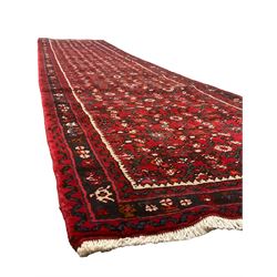 North West Persian Malayer runner, red ground field decorated with Herati motifs, guarded border decorated with trailing flowerhead band 