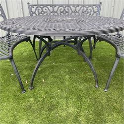 Cast aluminium garden table, and four curved bench seats, with rotating table top plate - THIS LOT IS TO BE COLLECTED BY APPOINTMENT FROM DUGGLEBY STORAGE, GREAT HILL, EASTFIELD, SCARBOROUGH, YO11 3TX