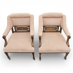 Quality Edwardian seven piece inlaid salon suite, comprising three seater settee, pair of arm chairs and four chairs with pierced splat backs, upholstered in pale pink fabric, inlaid with flowering urns, upon tapering legs with spade feet and castors