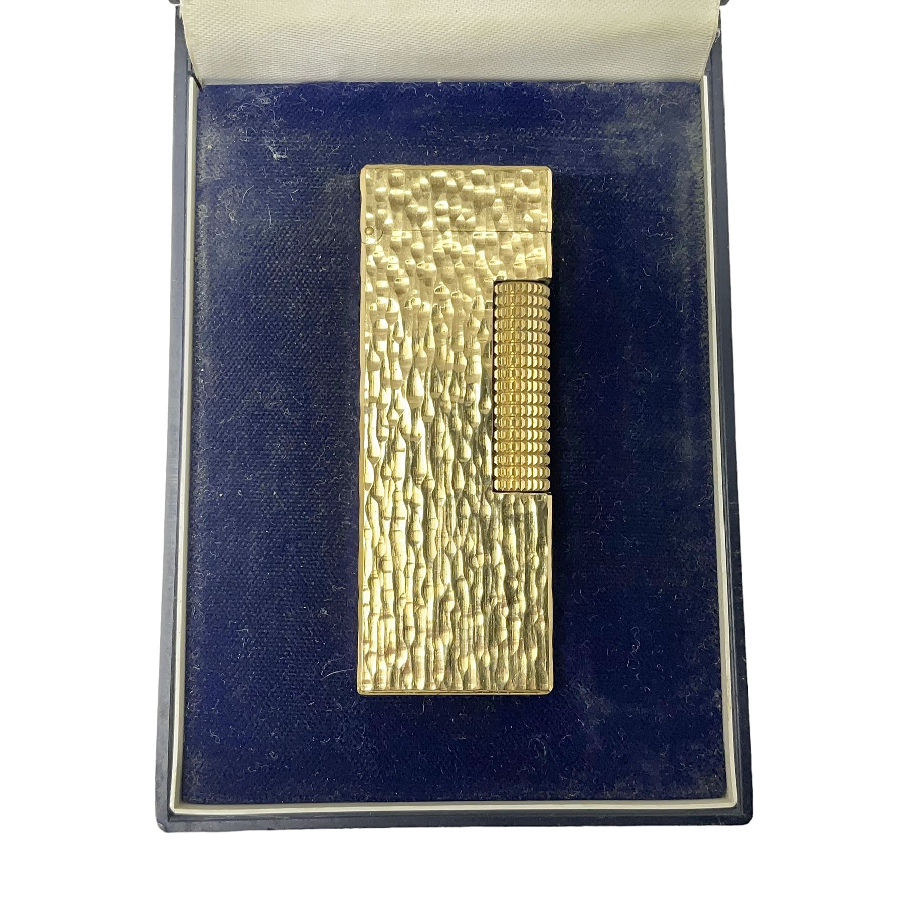 Dunhill gold plated lighter with textured bark effect decoration, in fitted case