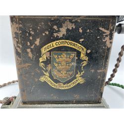Early 20th century Danish desk telephone inscribed The Ericsson Bell Telephone Co. Glasgow to one side and Aktieselskabet Electrisk Bureau Kristiansand to the other, ebonised wooden top with handset on brass cradle. black japanned tin centre section bearing Hull Corporation Telephones Department crest, side cranking handle and ebonised wooden base H30cm  