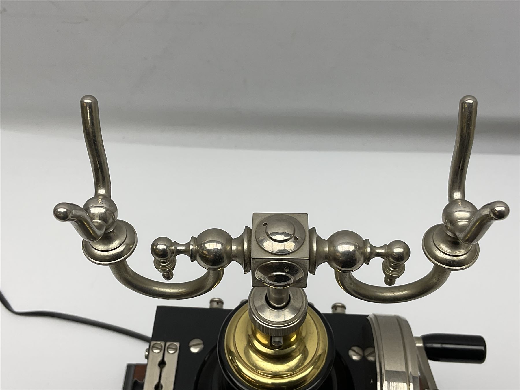 LM Ericsson of Sweden reproduction skeletal telephone, commemorating the centenary of the first 'Tax' in 1892, with gilded details on square walnut base with keypad and brass plaque beneath numbered 1892-09305, H35cm