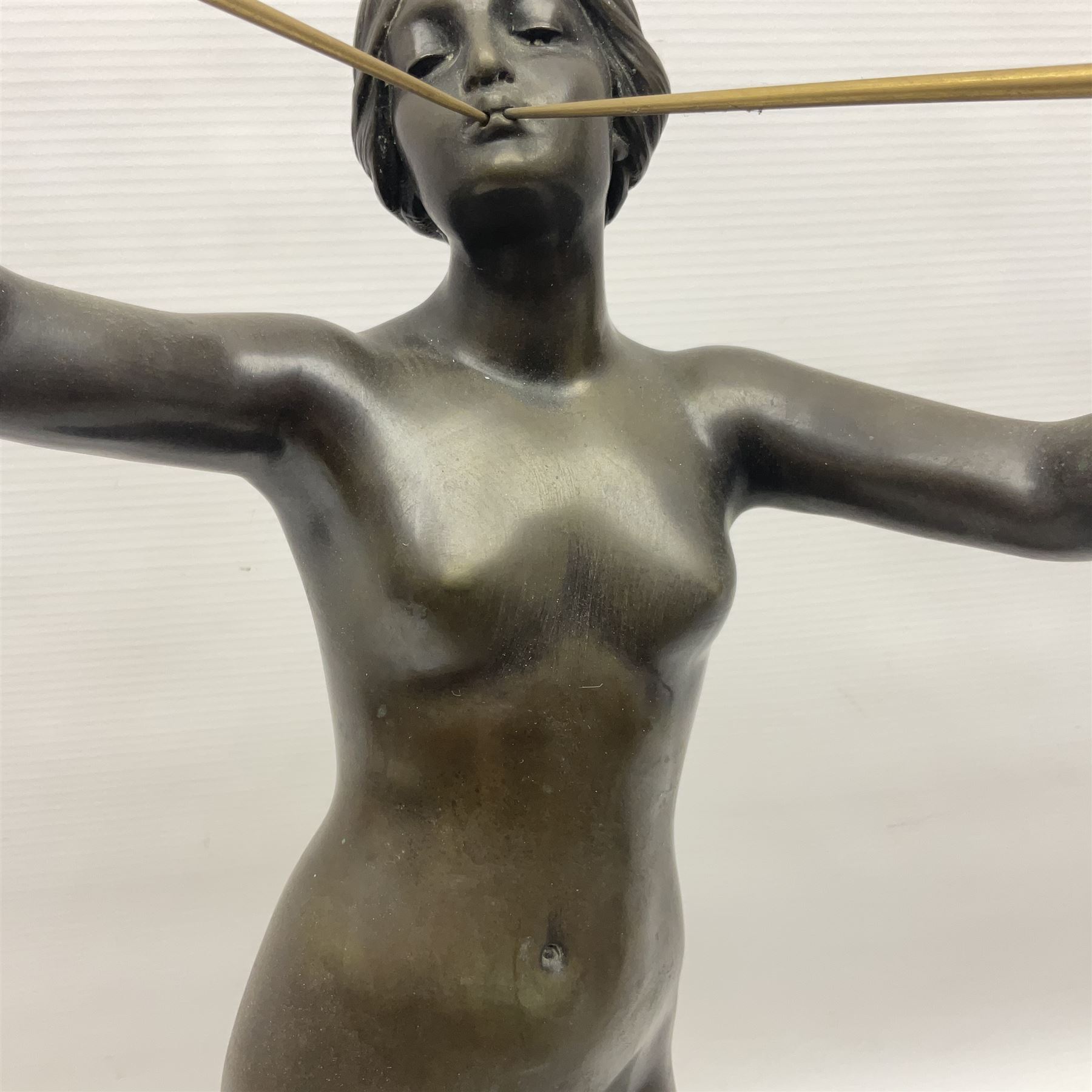 After Eugen Schlipf, Fanfair, bronzed female figure playing two horns, upon a circular marble plinth, H57cm