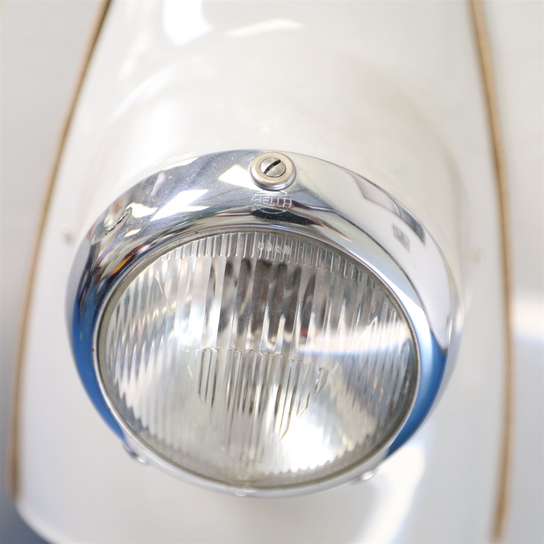 1957 Zündapp Bella R154 Scooter

• Registration: 150 KPU
• Year: 1957
• Model: Bella R154
• Engine: 150cc two-stroke single-cylinder petrol
• Transmission: Four-speed manual
• Odometer reading: 1,727 miles
• Colour: Ivory
• Seating: Dual seat
• V5C: Present
• Original registration book: Present
• Keys: 1

A characterful 1957 Zündapp Bella R154 scooter, finished in ivory with a contrasting brown dual seat and displaying an odometer reading of 1,727 miles.

The Bella R154 formed part of Zündapp’s distinctive range of German touring scooters, combining a 150cc air-cooled two-stroke engine with four-speed transmission, large wheels and substantial pressed-steel bodywork. This example retains its enclosed front apron, central headlamp, chrome handlebars, brightwork, period VDO speedometer and decorative Bella badging.

An operation and maintenance manual is include and accompanied by its V5C and original registration book from 1957.

This vehicle forms part of the Estate of the Late John Sills and is offered for sale by the Executors, confirming a genuine reason for sale.