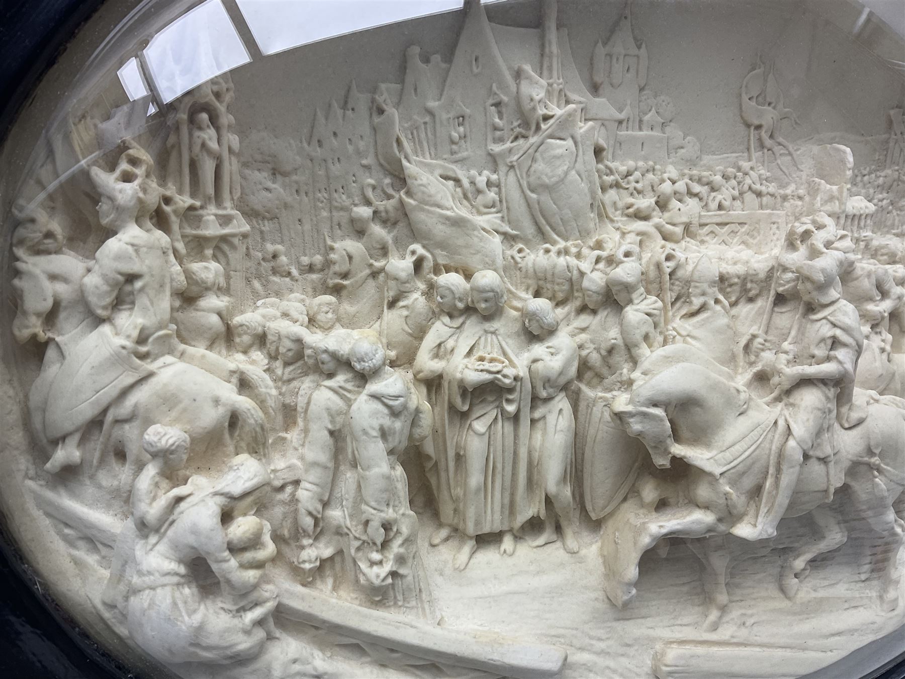 Justin Mathieu; oval high relief plaque depicting a battle scene, within frame H36cm
