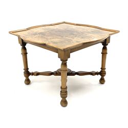 Early to mid 20th century figured walnut occasional table, shaped top with raised moulded edge, turned supports joined by x-shaped stretcher
