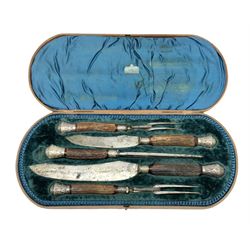 Victorian carving set, the blades stamped James Deakin and Son, Cutlers Sheffield, with part antler handles and silver plated foliate mounts, in B. Barnett of Hull lined fitted case, L47cm