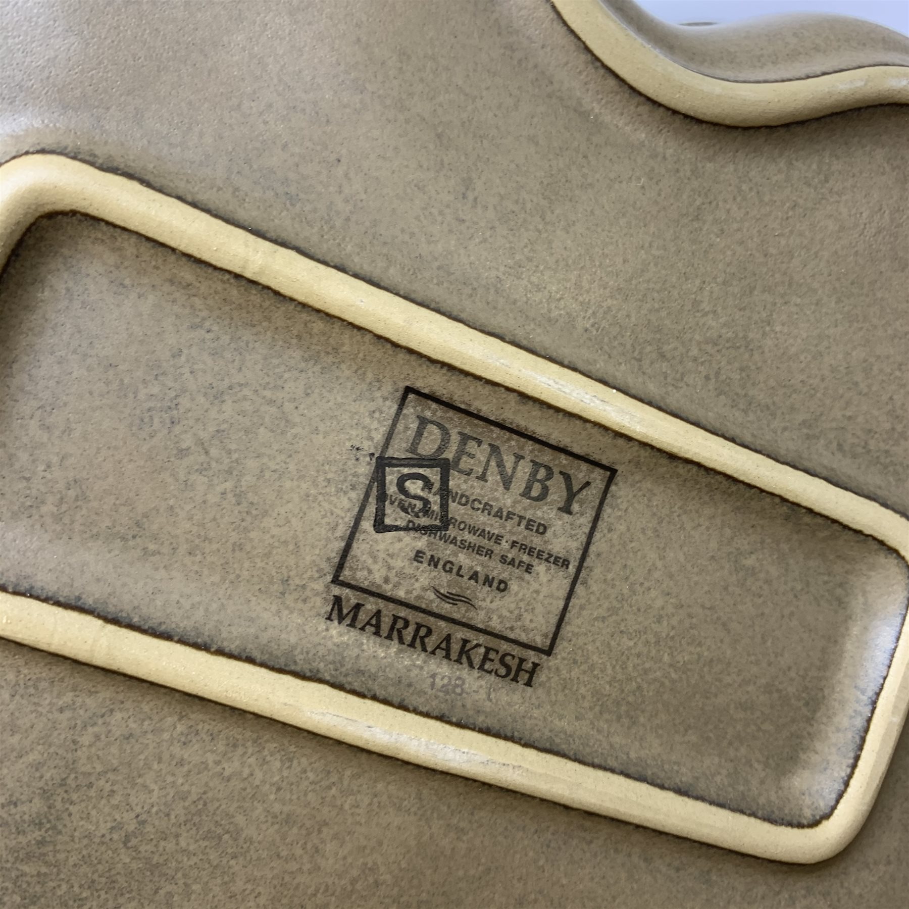 A Denby Marrakesh pattern dinner service, comprising six dinner plates, six dessert plates, seven side plates, two serving dishes, six bowls. six tea cups, six saucers, six coffee mugs, milk jug and saucer.
