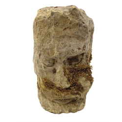  Late 18th century weathered sandstone male head with curled hair and grinning mouth, H36cm, D20cm  