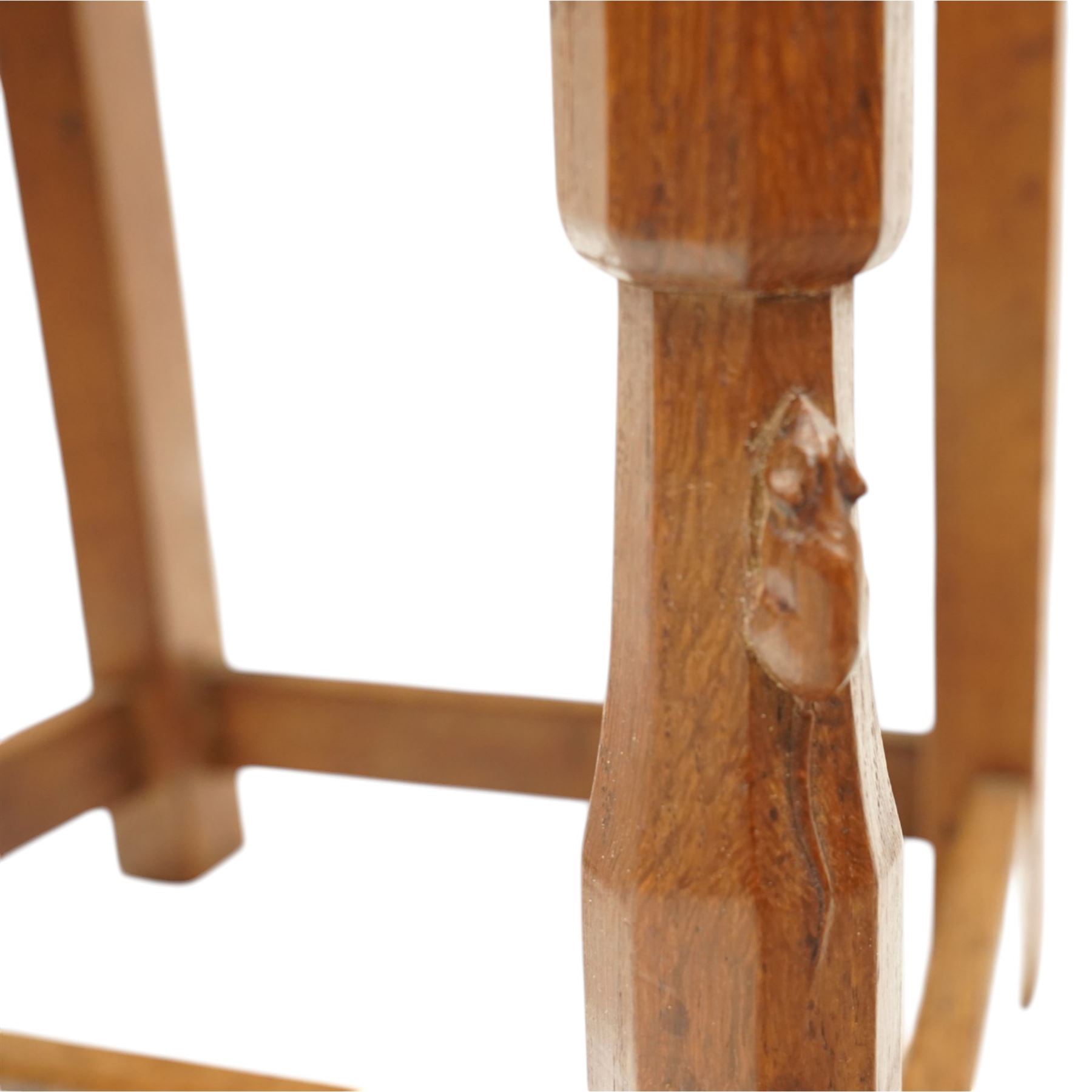 Mouseman - pair of 1940's adzed and panelled oak chairs, the rectangular adzed back-panel over seats upholstered in orange-tan leather with studwork, raised on turned octagonal supports united by box stretcher, with carved mouse signature, by the workshop of Robert Thompson of Kilburn
Provenance: purchased directly from the Kilburn workshop in the late 1940s