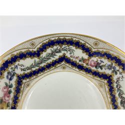 Sèvres soft paste porcelain coffee can and saucer with date code for 1767, painted with floral and laurel leaf garlands within blue scalloped and gilt borders, interlaced LL monogram enclosing the date letter O above painters mark for Catrice, coffee can H7.5cm, saucer D15cm
