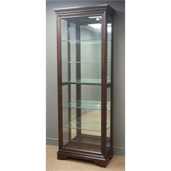 'Home Meridian International' mahogany bevel edged glass display cabinet, projecting cornice, half sliding door with moulded frame, shaped plinth base, W73cm, H203cm, D38cm    