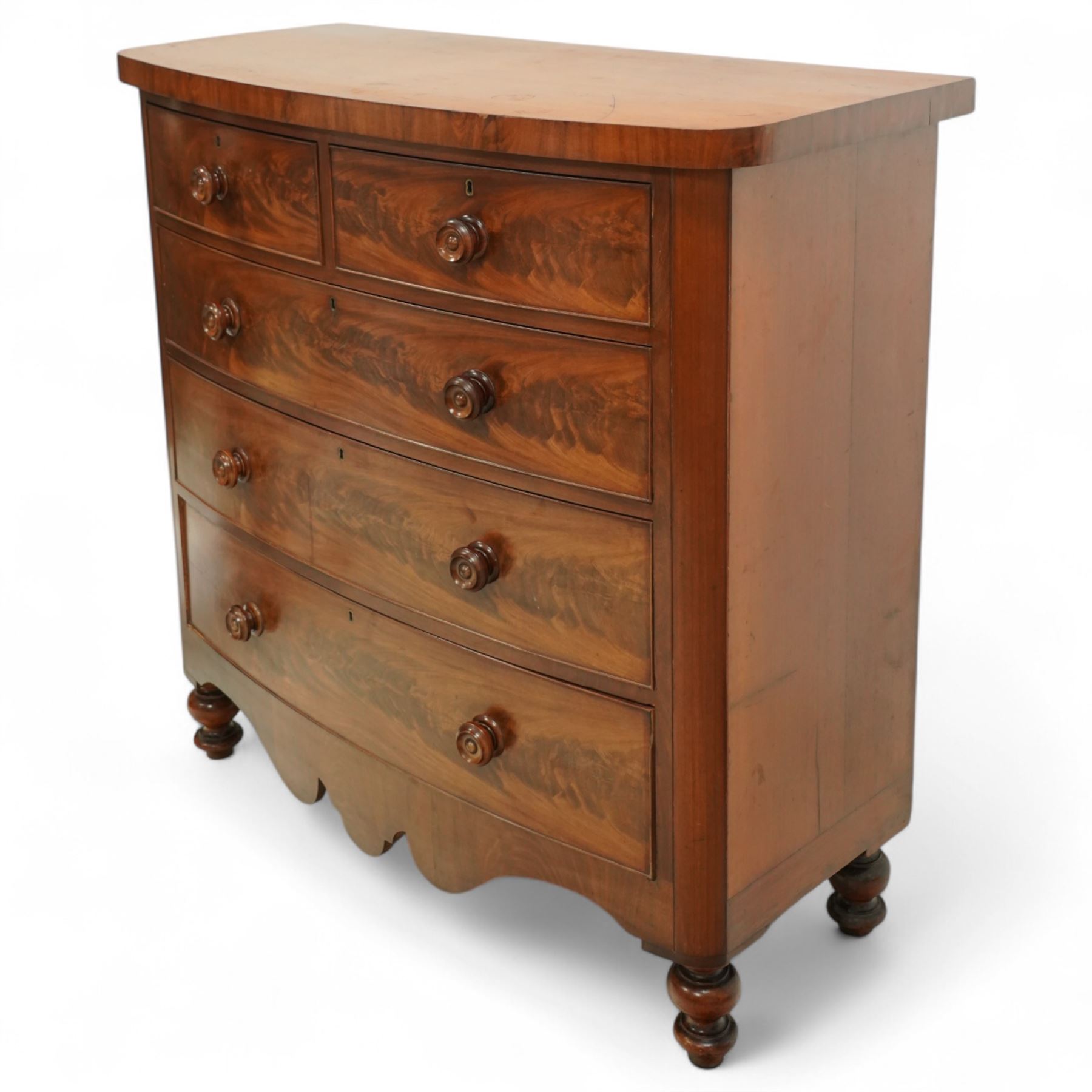 19th century mahogany bow front chest, with figured drawer fronts comprising two short over three long drawers, all with turned handles, shaped lower frieze and raised on turned supports
