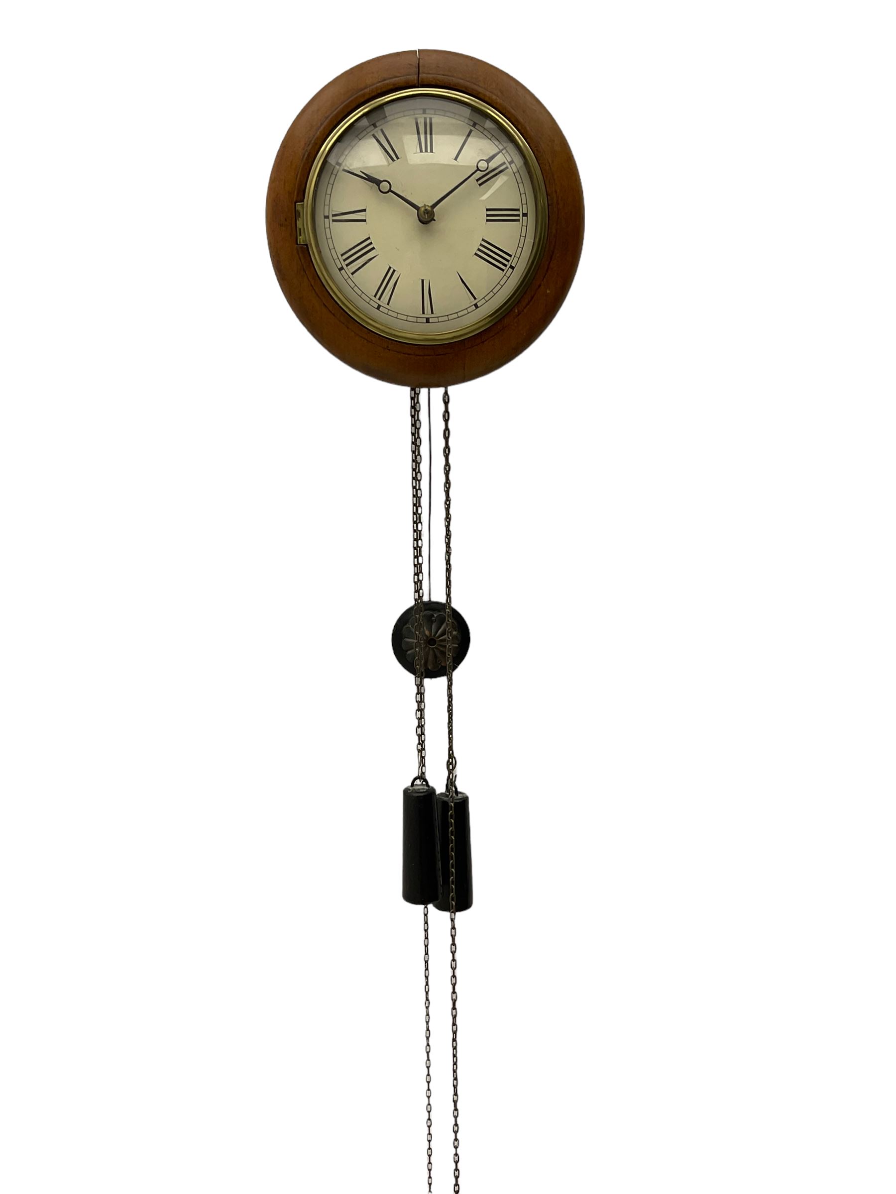Small late 19th century German Bavarian wall clock c1880, 6” painted dial with Roman numerals, minute track and steel moon hands, cast brass bezel and flat glass with a mahogany surround, chain driven striking movement striking the hours on a bell, wooden plated movement with brass wheels and lantern pinions. With original pendulum and original weights.

