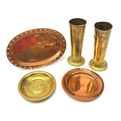 A pair of brass Arts and Crafts Beldray vases, each of slightly tapering cylindrical form on spreading circular foot, with embossed foliate tendril detail, with mark beneath, H21.5cm, together with a small Keswick style planished brass dish, with central embossed ship, D15.5cm, an oval copper tray with rivets to the rim, and a further copper dish. 