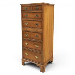 Georgian design yew wood pedestal chest, fitted with seven drawers and slide, brass drop handles