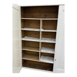 Late 19th-century painted pine housekeeper's cupboard with plinth base containing two large drawers with brass scalloped handles 