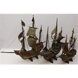  Three wooden models of three masted galleons, fully rigged with solid hulls, canvas sails and painted detail, on stands, L70cm, H58cm, max (3)   