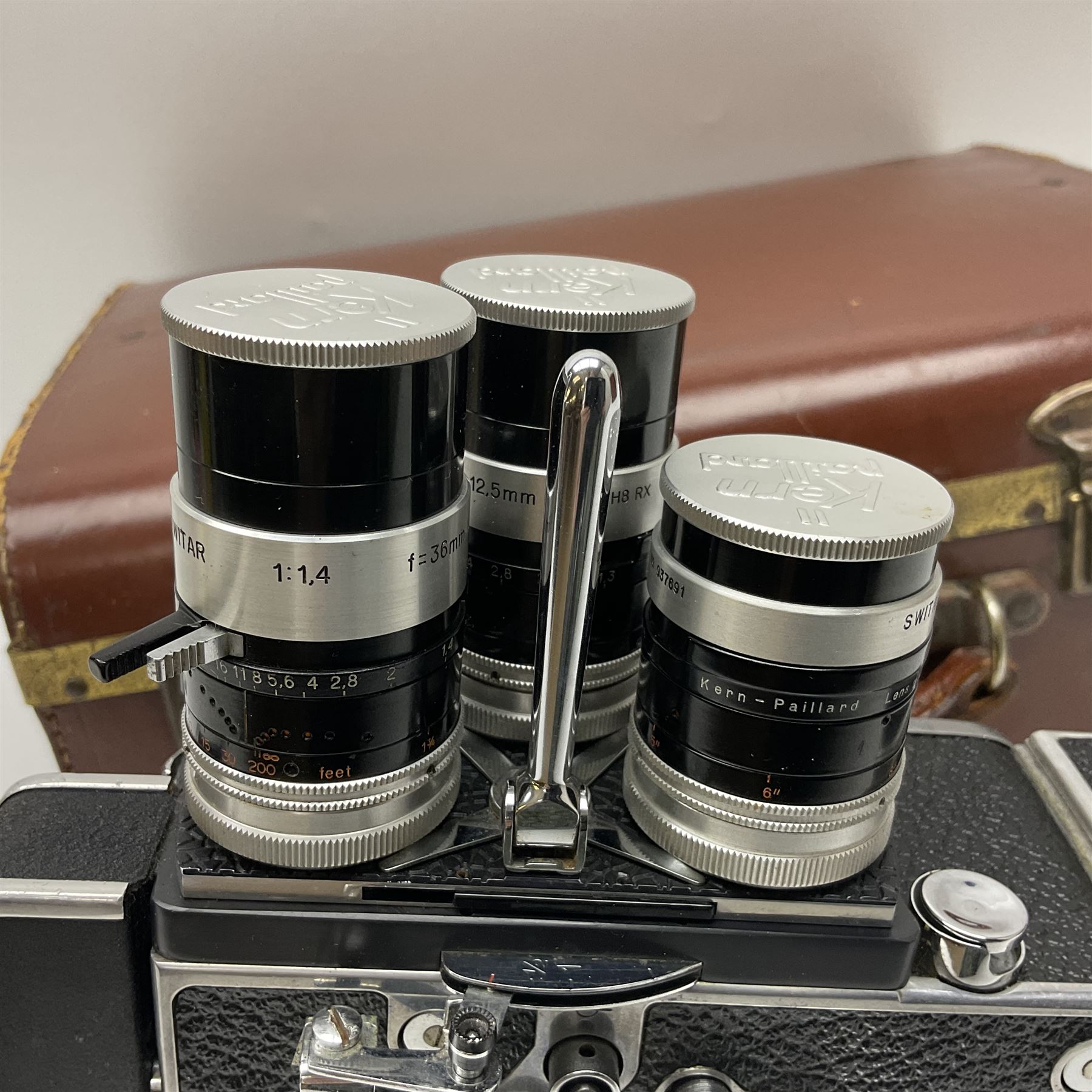 Paillard Bolex H8 RX4 cine camera body with turret for interchangeable lenses, serial no. 216071, with 'Macro Switar H8RX f1.4 36mm' lens, serial no.863406, 'Macro Switar H8RX f1.3 12.5mm' lens, serial no. 865770, 'Switar H8RX f1.6 5.5mm' lens, serial no. 937691 and RX fader, in fitted leather case