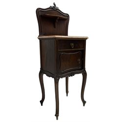 Late 19th to early 20th century walnut bedside pot cupboard, the shaped raised back with carved C-scroll pediment, pink variegated marble top, fitted with single drawer and cupboard, foliage carved cabriole supports with scroll carved terminals