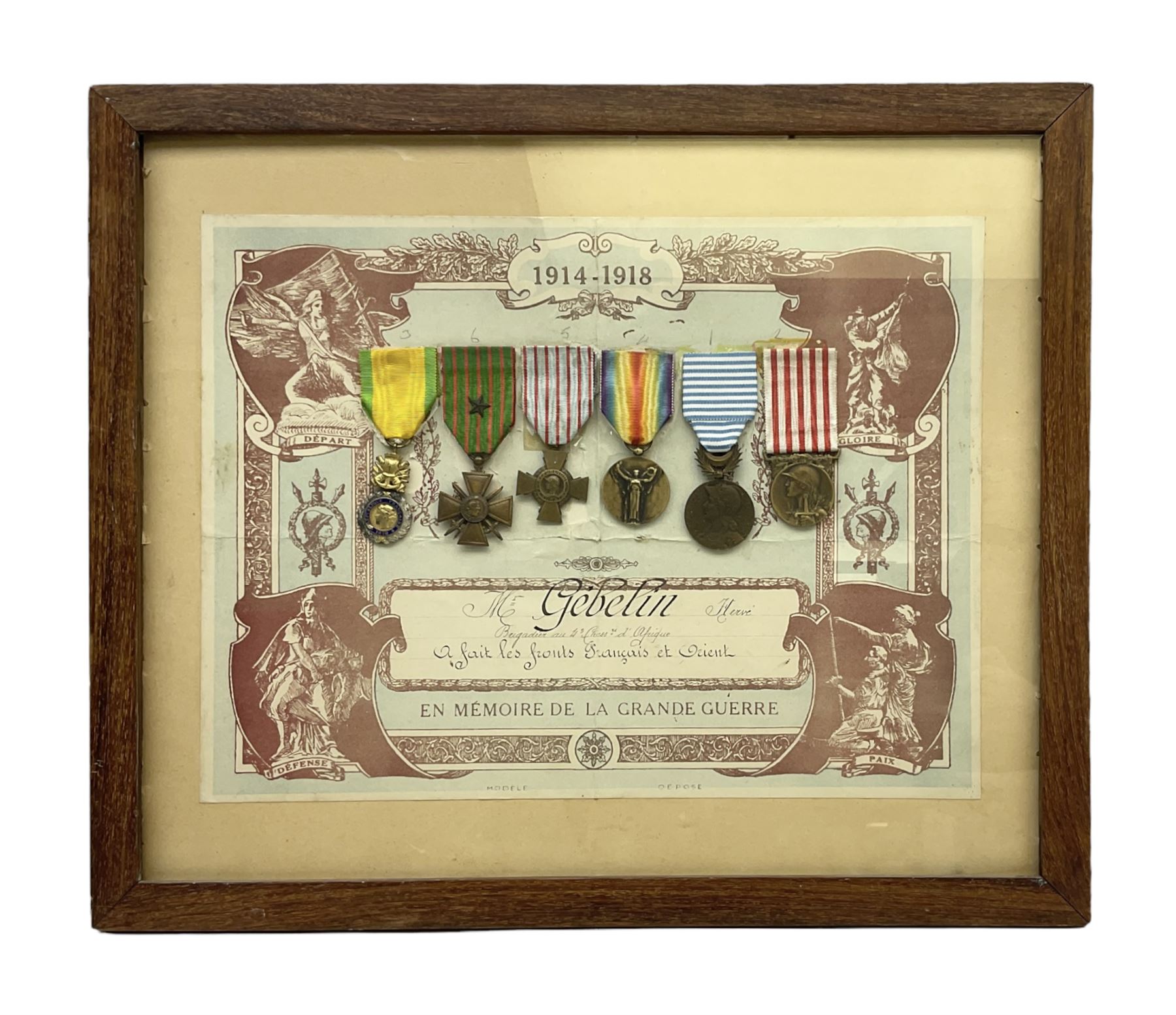 Six WW1 French medals comprising Valor Discipline 1870 3rd Republic Military Medal, Croix De Guerre with star, Croix Du Combattant, Medaille Inter-Alliee De La Victorie, Orient Medal and Medaille Commemorative De La Grande Guerre 1914-18; all with ribbons; mounted, framed and glazed with certificate named to Mr. Gebelin Herve Brigadier au 4th Chassrs. D'Afrique