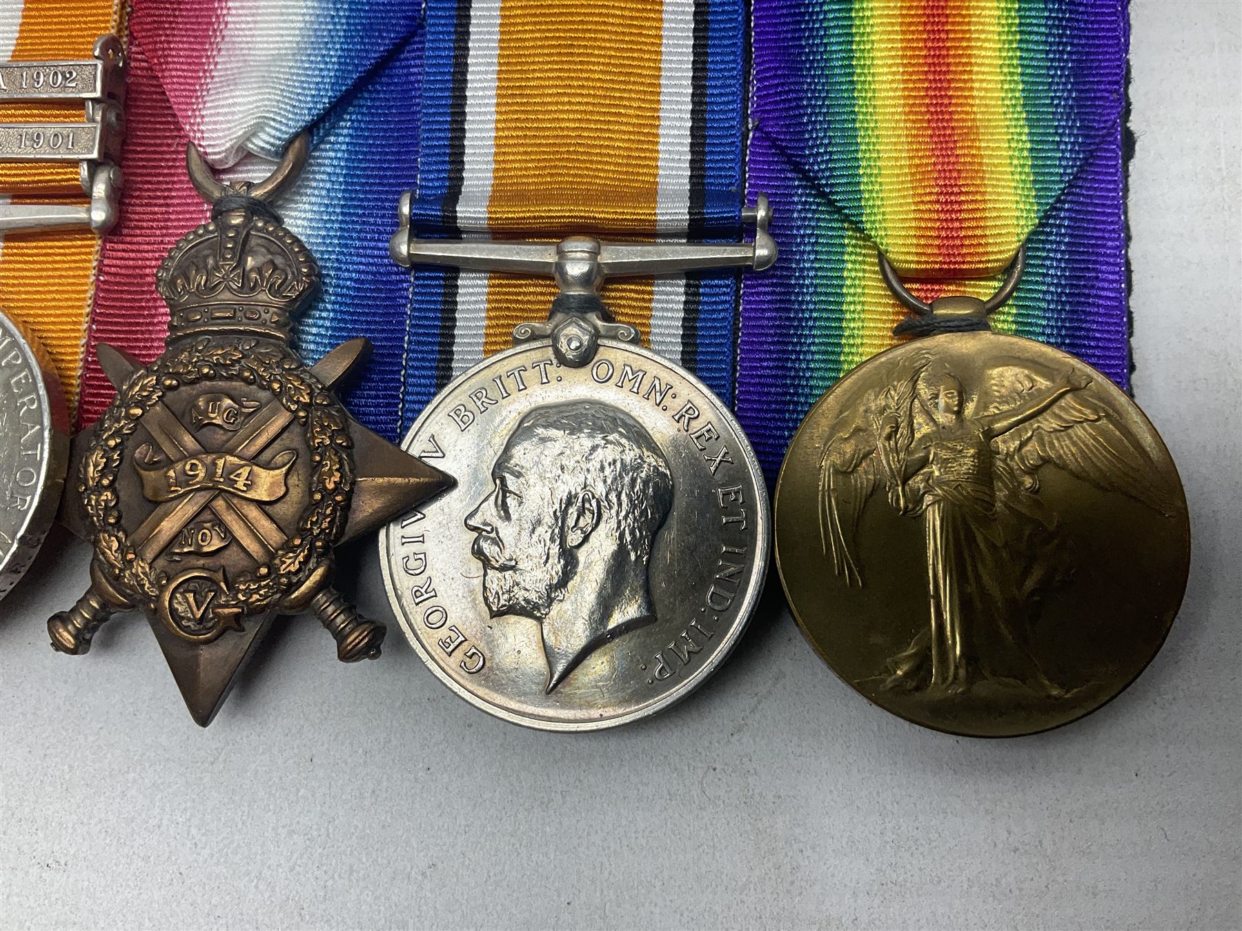 Boer War/WW1 group of five medals comprising Queens South Africa Medal with Transvaal clasp and Kings South Africa Medal with two clasps for South Africa 1901 & 1902 awarded to  2269 Pte. G. Thompson K.R.R.C.; together with British War Medal, 1914 Star and Victory Medal awarded to 6683 Pte. G.H. Thompson 3-HRS.; all with ribbons mounted for display on card; together with copy death certificate following discharge due to being physically unfit and other biographical photocopies.