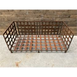 Wrought iron strapwork garden day bed, lattice back and sides