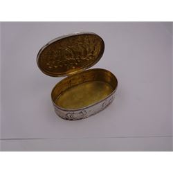 Late 19th century German Hanau silver box, of oval form, embossed throughout with putti in various scenes including riding a dog, playing instruments, pulling a cart and dancing, opening to reveal a gilt interior, with Hanau marks for B Neresheimer & Sohne, W9cm, H3cm