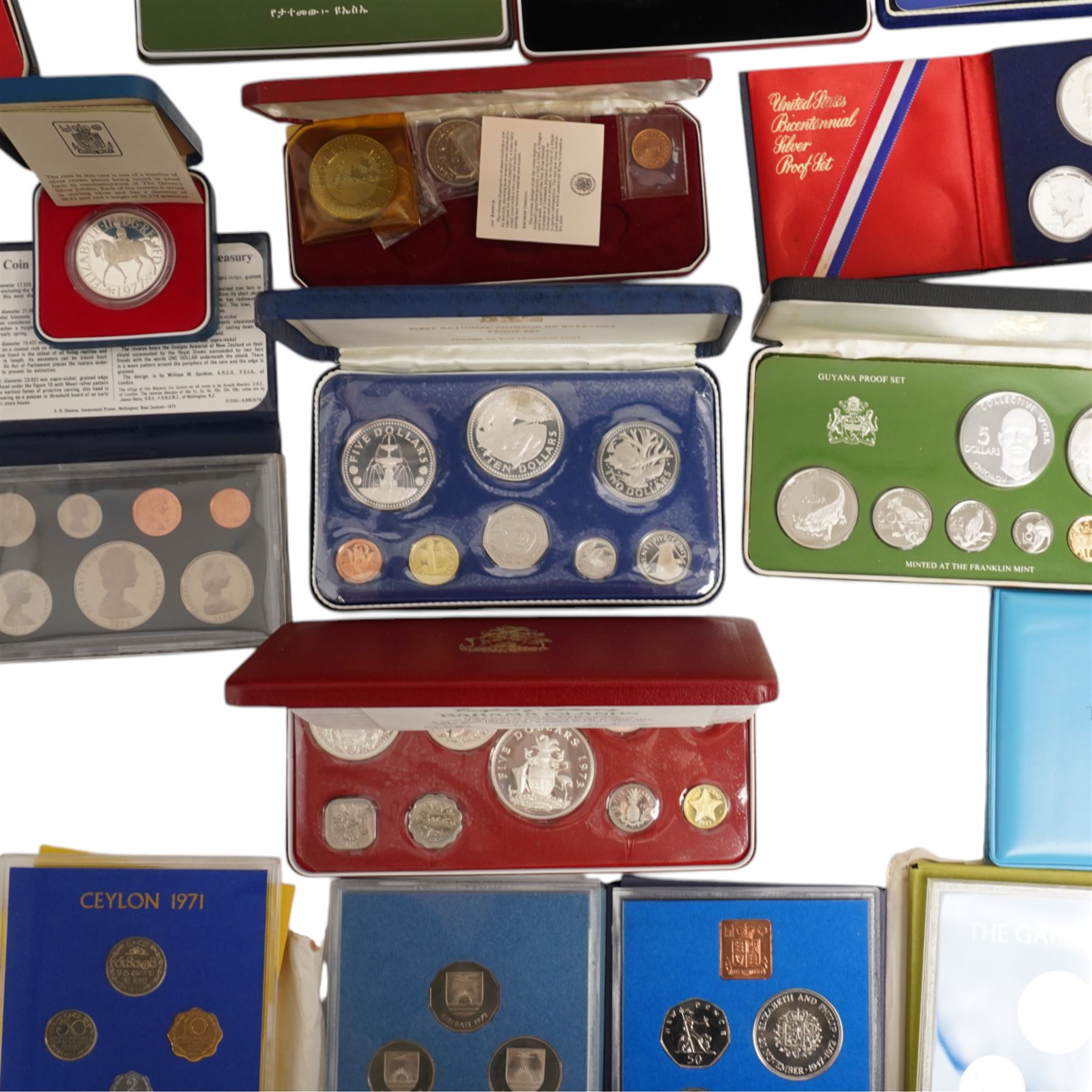 Twelve international proof coin sets, all produced by The Franklin Mint and containing high denomination silver coins, comprising two Republic of the Philippines 1975 proof eight coin sets, two Commonwealth of the Bahamas proof nine coin sets, 1973 and 1976, Guyana 1976 proof eight coin set, Jamaica 1976 proof nine coin set, Papua New Guinea 1976 proof eight coin set, First National Coinage of Barbados 1973 proof eight coin set, Ethiopia 1977 proof five coin set, Republic of Seychelles 1976 proof eight coin set, British Virgin Islands 1977 Royal Silver Jubilee proof six coin set, First Official Coinage of the British Virgin Islands 1973 proof six coin set; together with Pobjoy Mint Isle of Man 1977 silver proof seven coin set, 'Commemoration of the 1100th Anniversary of the Settlement of Iceland' 1974 proof two coin set, The Royal Mint United Kingdom 1977 Silver Jubilee silver proof crown coin, and other international proof sets