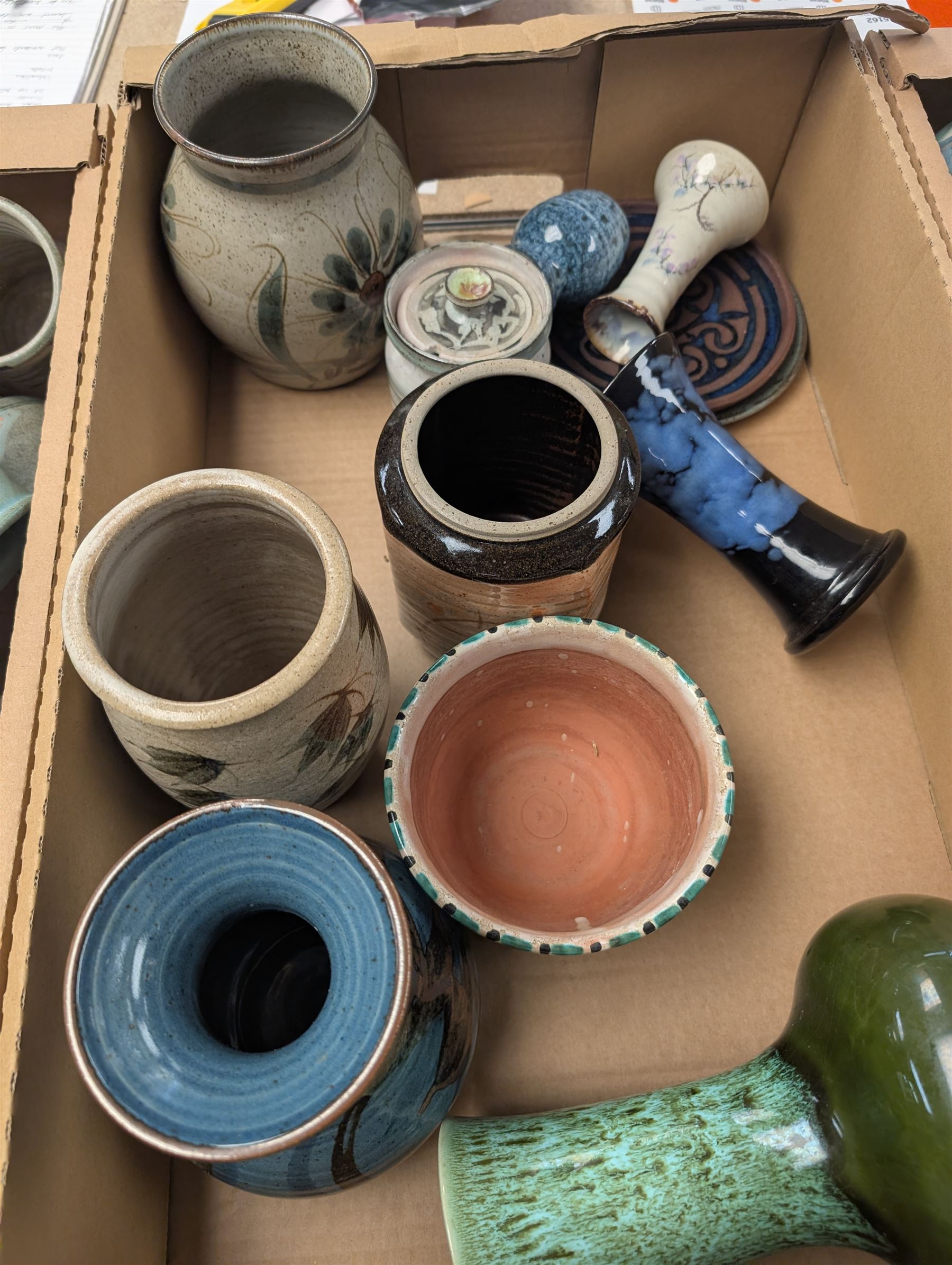 Collection of studio pottery, including bowls, vases, goblets and bottles, in four boxes 