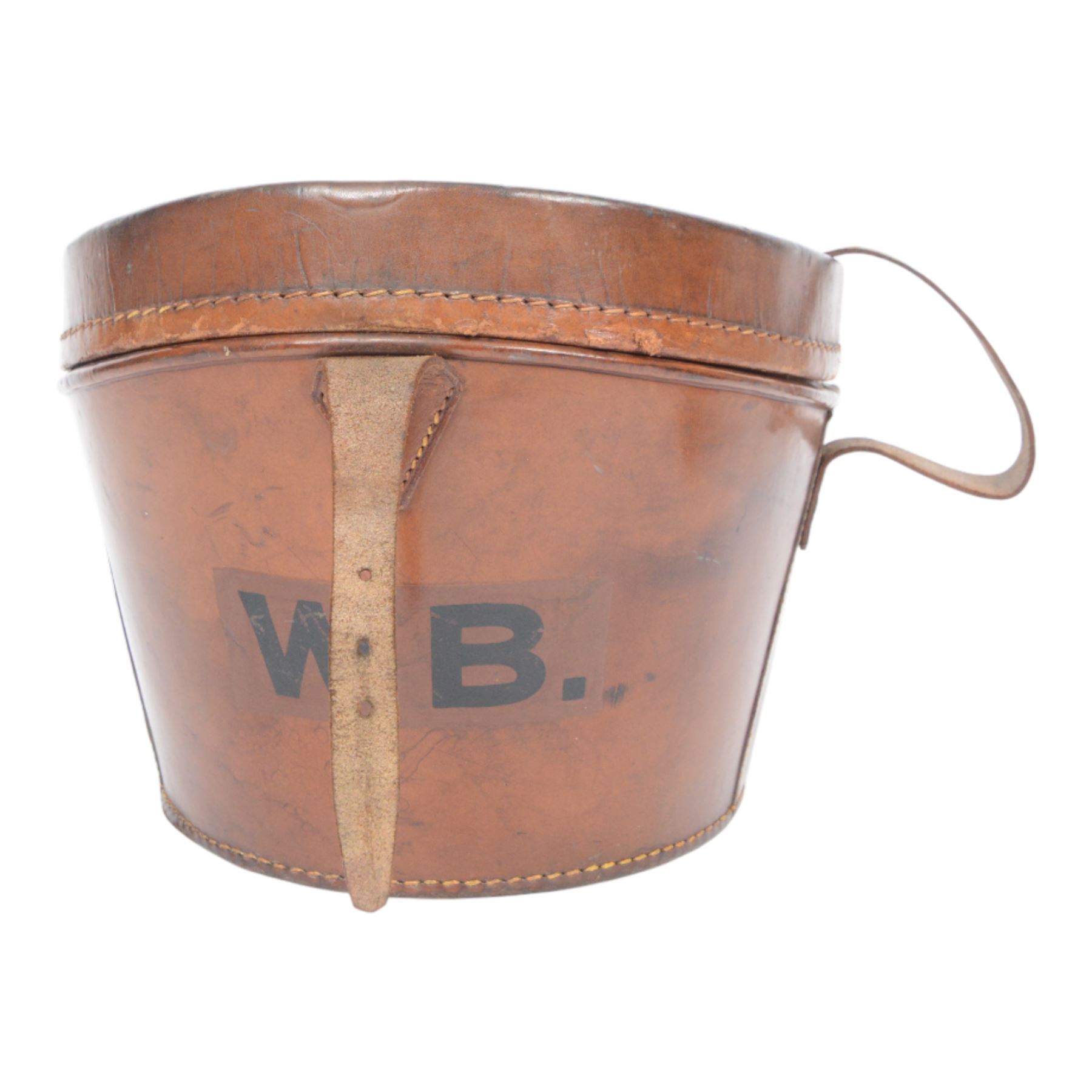 Bowler hat, by Moores, with retail label for Kendall of Scarborough, with brown leather top hat box having a handle to the lid and buckle fastening, lined in red velvet, marked W.B. to the front 