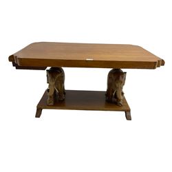 Hardwood coffee table on carved elephant figure supports, platform base on sledge feet