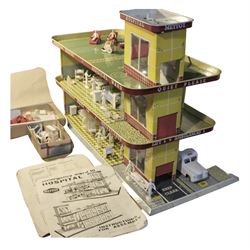 Late 1950s/early 1960s Mettoy tin-plate Emergency Ward 10 hospital set from the TV series, including over twenty figures, over sixty pieces of hospital equipment, beds, chairs, lockers, theatre fittings, stretchers etc; building is complete with movable transparent partitions, operating lift with sliding lift shaft doors and opening windows; wards with fitted swing doors; tin-plate walls with lithographed detail in yellow with red and white tiled effect, cobbled base with ambulance casualties area and lift access; boxed with instructions