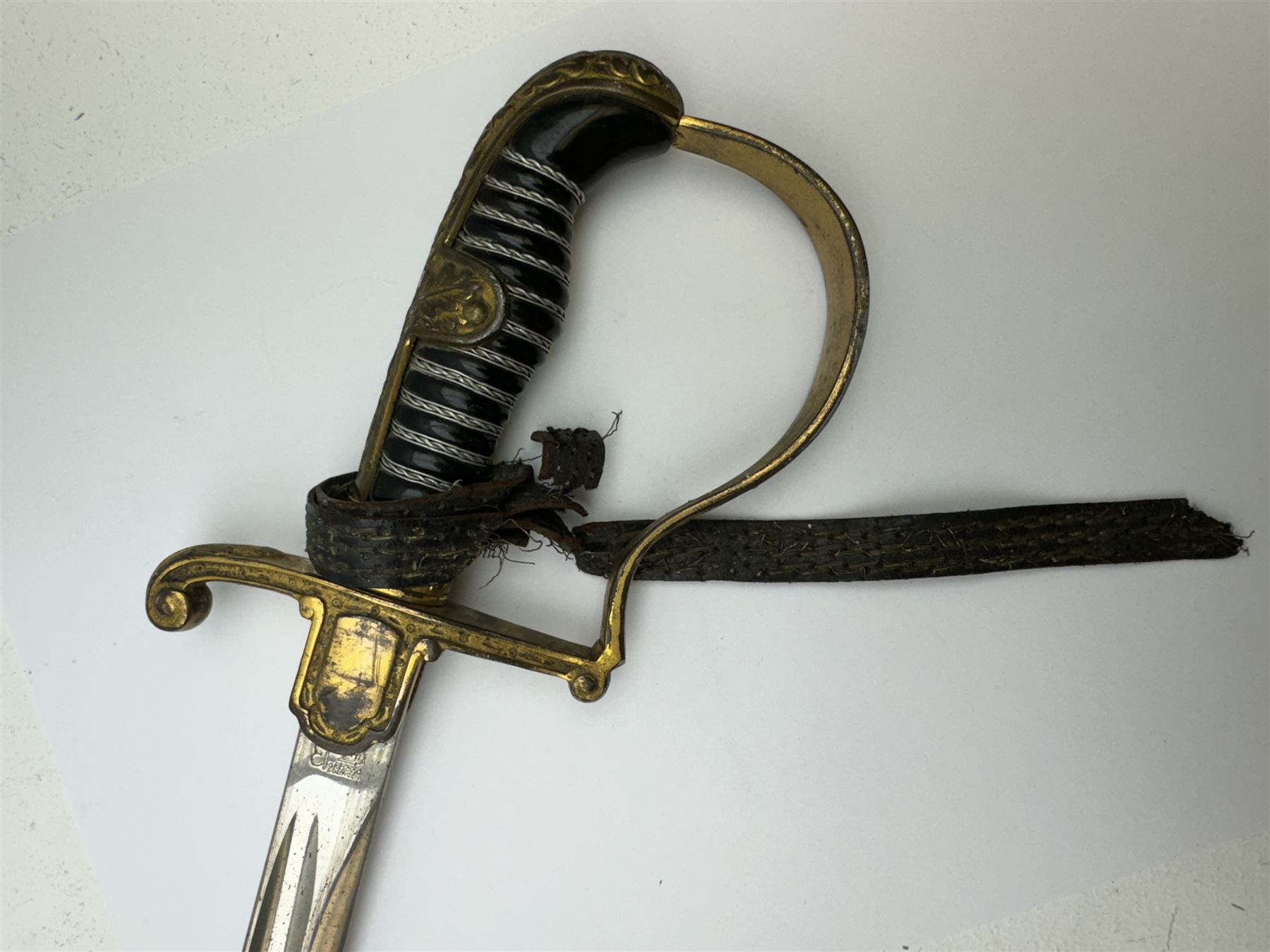 German infantry dress sword, dove head stirrup handle with black wire-bound grip cast cross guard with German eagle set into the langet, the curved 81cm single edge blade with single fuller marked Elckhorn Solingen, L93cm overall